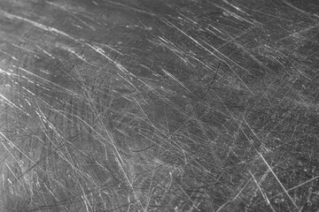 Fototapeta na wymiar Texture of scratched metallic surface as background, closeup