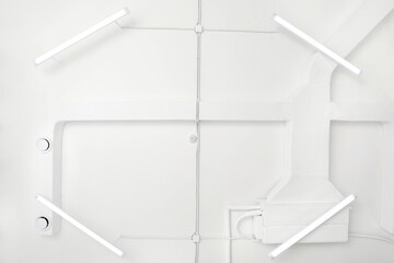 White ceiling with modern lighting in room, bottom view