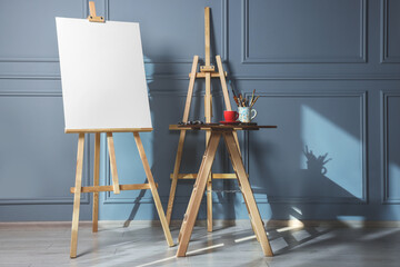 Premium Vector  Easel paint stand and canvas