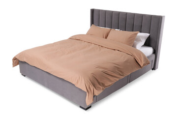 Fototapeta premium Comfortable gray bed with beige linens on white background