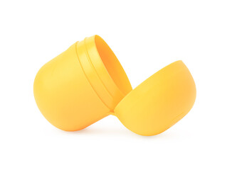 Slynchev Bryag, Bulgaria - May 23, 2023: Opened yellow plastic capsule from Kinder Surprise Egg isolated on white