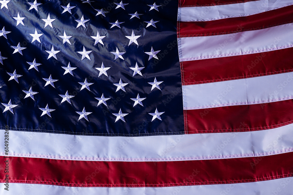 Wall mural closeup shot of the waving flag of the United States of America with interesting textures