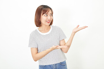 Charming young Asian businesswoman with a short brunette wearing a t-shirt and jeans standing on a white background copy space