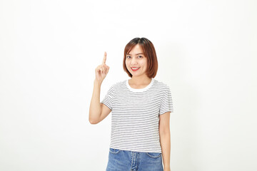 Charming young Asian businesswoman with a short brunette wearing a t-shirt and jeans standing on a white background copy space