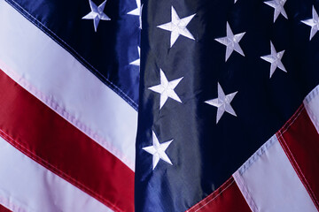 close up shot of the waving flag of the United States of America with interesting textures