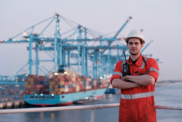 Offshore technician. Seafarer. Seaman. Navigator. A man in a boiler suit is standing in front of...