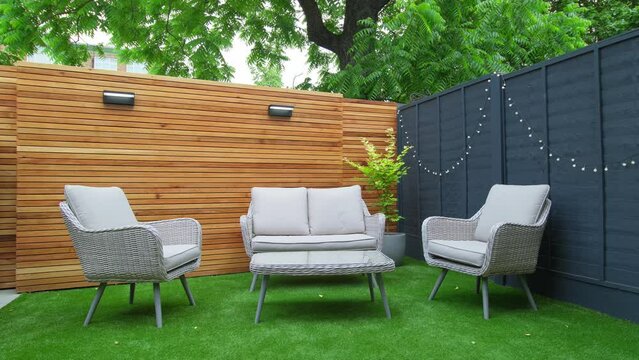 Stunning Garden Seating Area with Wooden Cedar Slat Wall, Artificial Grass Lawn and Bespoke Lighting