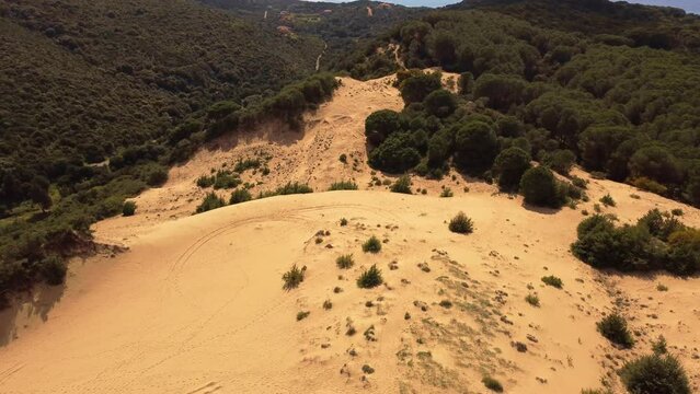 Spectacular bright golden dune in South Sardinia, explore wilderness, aerial