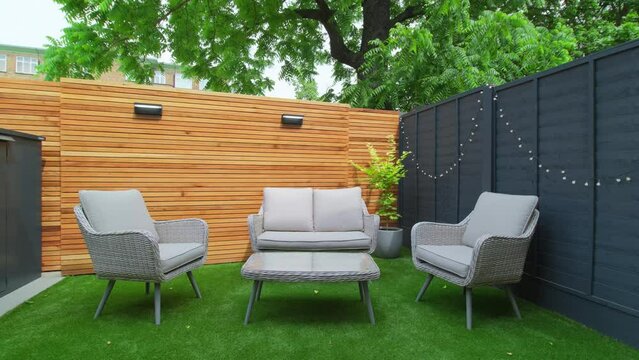 Small Modern Home Garden with Beautiful Slat Wood Feature Wall, Outdoor Furniture, Smart Lighting and Acer Pot Plant