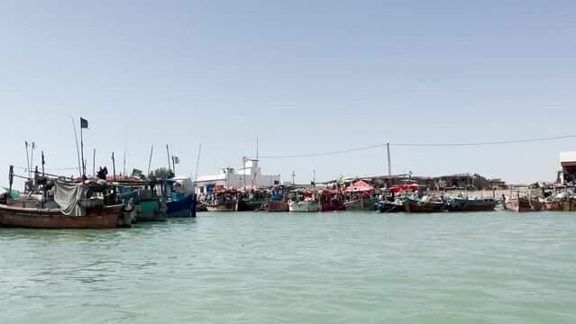 POV Sailing Past Rows Of Fishing Boats Near Damb Beach,  Balochistan