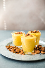 Authentic Indian cold drink made up of curd, milk malai called Lassi in saffron, kesar flavour, also called kesariya or keshariya or kesar lassi, served in  glasses