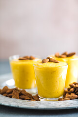 Authentic Indian cold drink made up of curd, milk malai called Lassi in saffron, kesar flavour, also called kesariya or keshariya or kesar lassi, served in  glasses