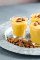 Authentic Indian cold drink made up of curd, milk malai called Lassi in saffron, kesar flavour, also called kesariya or keshariya or kesar lassi, served in  glasses