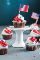 Independence Day Fourth of July USA American patriotic party with american symbols. Cupcakes dessert decorated cream cheese or buttercream.
