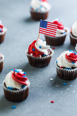 Independence Day Fourth of July USA American patriotic party with american symbols. Cupcakes dessert decorated cream cheese or buttercream.