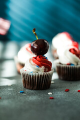 Independence Day Fourth of July USA American patriotic party with american symbols. Cupcakes dessert decorated cream cheese or buttercream.