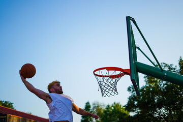Man dunking on a basket
