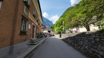 Narrow street in Hallstatt mountain town, district of Gmunden, Austria.