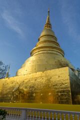 Fototapeta premium Phrathatluang, Golden figurines of elephants at temple Wat Phra Singh. Thailand.