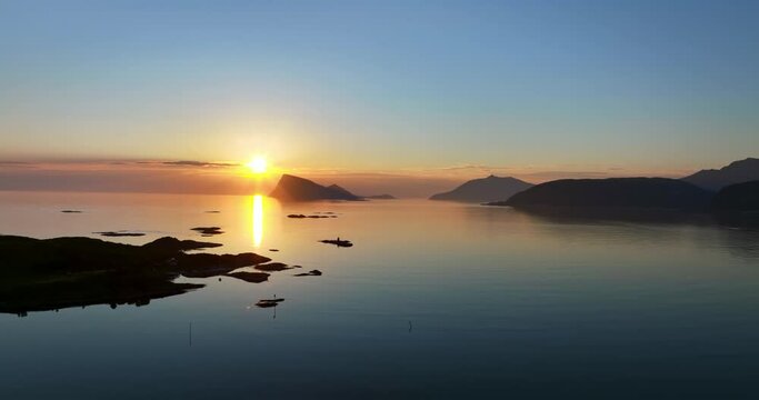 Aerial view of sunset above the Haja island, nightless night in Sommaroy, Norway