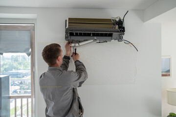 Installation of air conditioner by professional specialised climate control service in apartment....