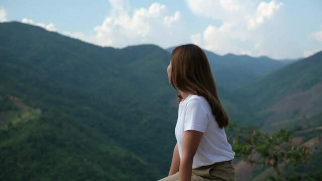 A woman looking at a beautiful mountains view