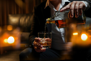 Closeup businessmen holding a glass of whiskey