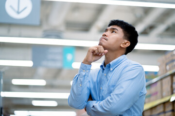 Employees are Asians who work hard in the shopping mall. Back pain while working. Fatigue,...