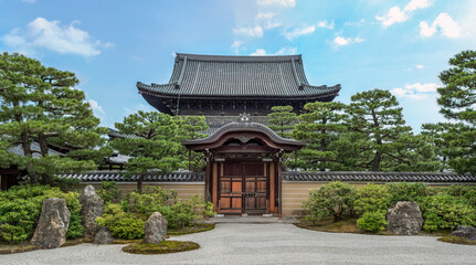 interior garden of the kenninji temple with karesansui style, a stone path and a background of trees. It is a Buddhist temple with more than 800 years