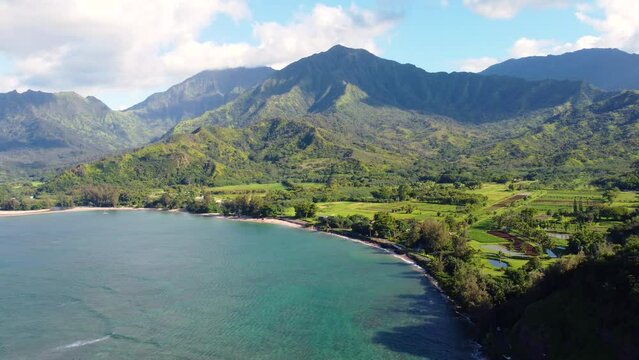 Breathtaking Aerial panoramic shot of Hanalei Bay and Hanalei Valley and green mountains with the Hanalei River near Princeville, Kauai, Hawaii.