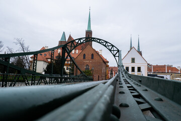 Tumski bridge and Wroclaw Cathedral. Wroclaw historic center cityscape. City hall architecture buildings. Old town landmark cathedrals church. Travel tourist destination 