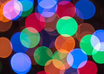 Colorful bokeh: a mesmerizing blend of vibrant, blurred lights, creating a dreamy, whimsical atmosphere that enchants the senses