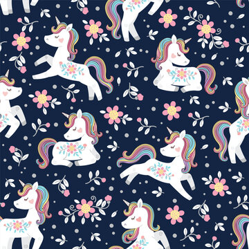 White unicorn with rainbow mane and tail. Vector seamless pattern with cute unicorns on dark floral background