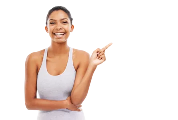  Isolated woman, fitness portrait and pointing with smile for promotion, gesture or vote by transparent png background. Girl, model or personal trainer with finger point, announcement or deal at gym © Suresh Heyt/peopleimages.com