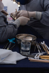 A typical open rhinoplasty operation. Focus on the operating tray with the surgical instruments.