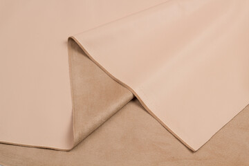 Leather suede red close-up background texture. Skin