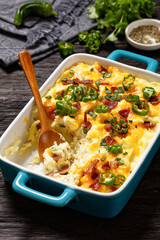 Loaded smashed potatoes with cheese, bacon, cream