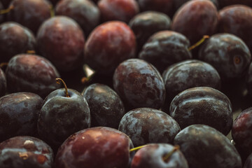 Fresh plums on the table, close-up