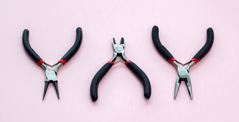 pliers, pliers, round pliers, tweezers, tools for jewelry and jewelry creation. dIY. background...