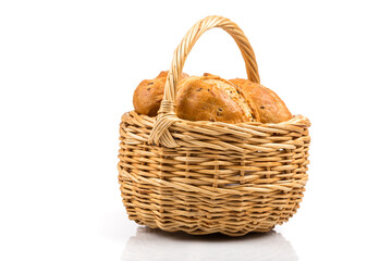 bread in wicker basket isolated on white