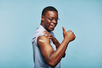 Man giving the thumbs up after vaccination