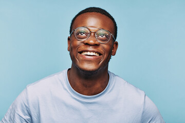 African man looking up and smiling