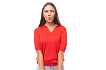 young caucasian brunette in a red short-sleeve shirt sends an air kiss