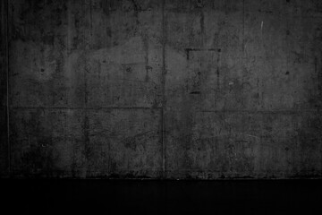 Grungy dark concrete wall and wet floor