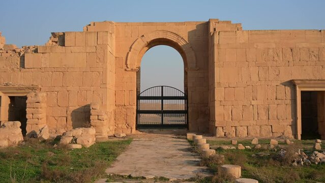 Dolly View of Ancient Outdoor Gate and Rock Wall at Hatra Ruins in Iraq, Archaeology Site