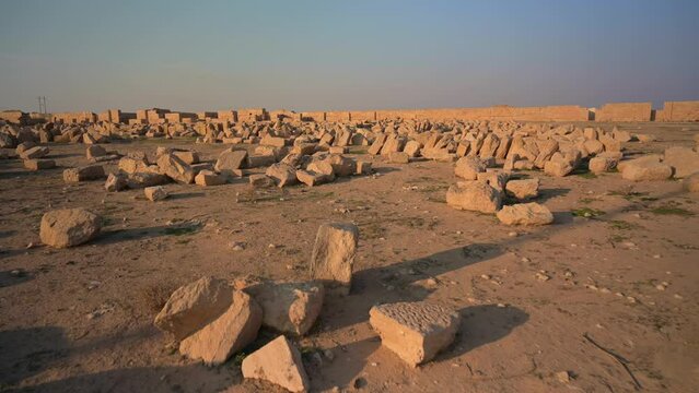 Ancient Rocks on Vast Sandstone Land at Hatra Ruins, Archaeology Outdoor Site in Iraq at Sunset 