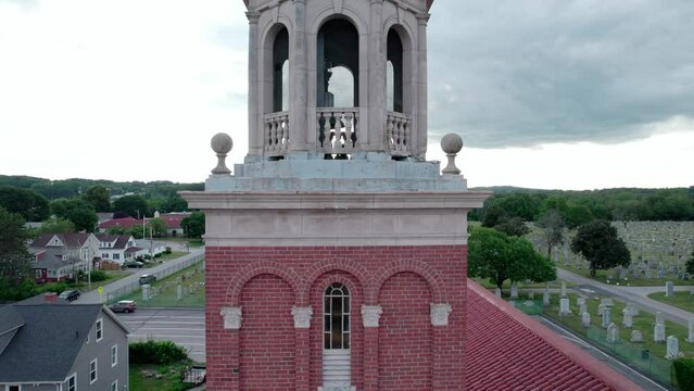 Rising views of the bell tower with cross of Saint Marys Church, Cranston.