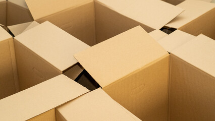 open cardboard boxes close-up, cutout for handle in cardboard box - obrazy, fototapety, plakaty