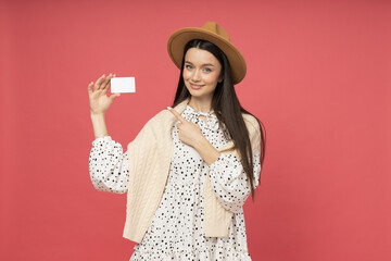 Young woman with discount card in hands