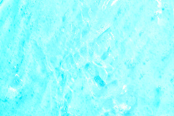 Cosmetic gel close-up with oxygen bubbles. Textured background with microbrushes in cosmetics. Moisturizing skin serum with vitamins and collagen.